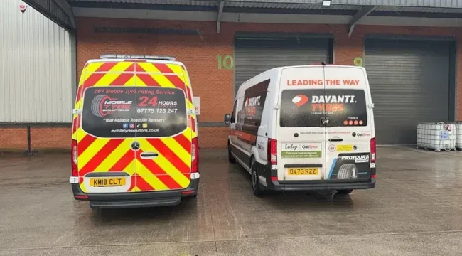 Emergency mobile tyre replacement technician replacing flat tyre at home